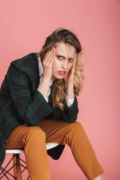 Photo of adult businesswoman sitting in chair and grabbing head — Stock Photo, Image