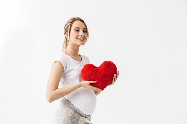 Mooie jonge zwangere vrouw staande geïsoleerd — Stockfoto