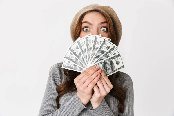 Shocked beautiful woman holding money isolated over white wall background. — Stock Photo, Image