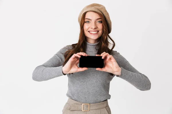 Woman isolated over white wall background showing display of mobile phone. — Stock Photo, Image