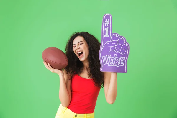 Porträt einer Anhängerin Zwanzigers mit Fanhandschuh Nummer eins und — Stockfoto