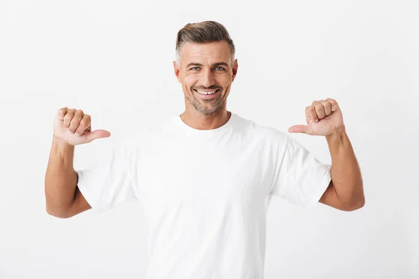 Image of joyful man 30s with bristle wearing casual t-shirt poin — Stock Photo, Image
