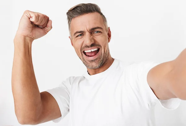 Image closeup of ecstatic man 30s wearing casual t-shirt looking — Stock Photo, Image