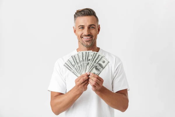 Image of happy man 30s wearing casual t-shirt smiling and holdin — Stock Photo, Image