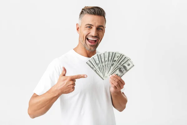 Image of cheerful man 30s wearing casual t-shirt smiling and hol — Stock Photo, Image