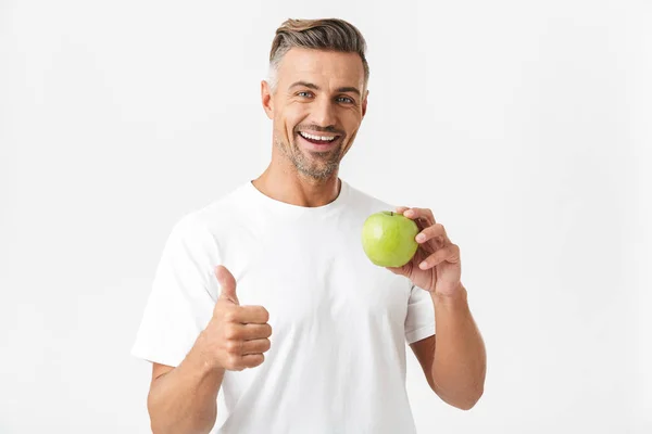 Retrato de un hombre sano de 30 años con cerdas en camiseta casual pos — Foto de Stock