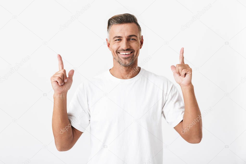 Image of unshaved man 30s with bristle wearing casual t-shirt po