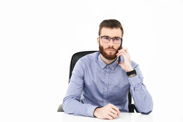 Calm bearded elegant man in eyeglasses talking by smartphone — Stock Photo, Image