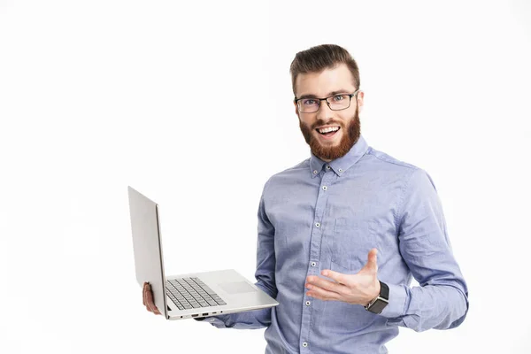 Surprised happy bearded elegant man in eyeglasses holding laptop computer — Stock Photo, Image