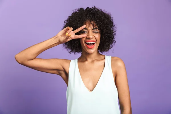 Portrait of a cheerful african woman wearing dress — Stock Photo, Image