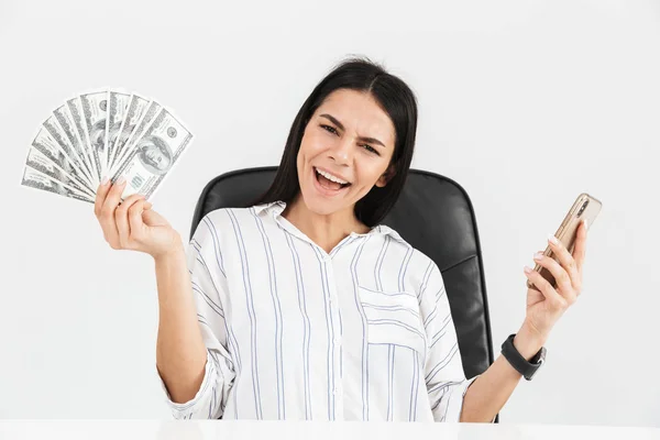 Photo of rich businesswoman 30s holding smartphone and fan with — Stock Photo, Image