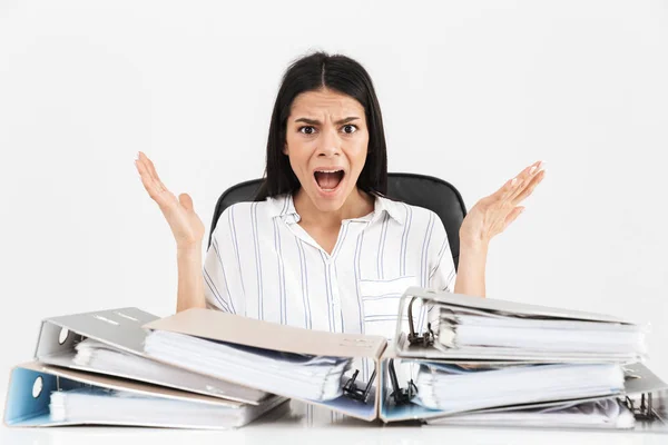 Photo of nervous brunette businesswoman 30s working and sitting — Stock Photo, Image