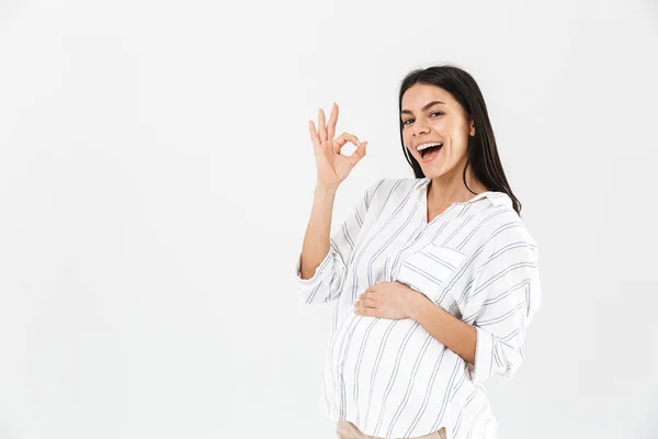 Photo of positive pregnant woman 30s with big belly smiling and — Stock Photo, Image