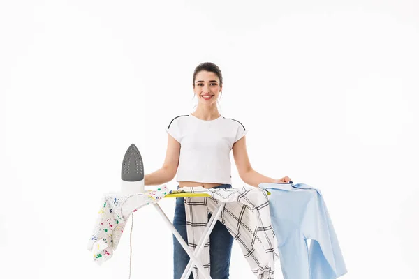 Photo of joyful woman housewife 20s wearing casual jeans ironing — Stock Photo, Image