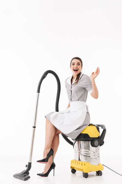 Full length photo of gorgeous maid 20s dressed in uniform sittin — Stock Photo, Image