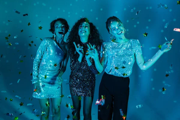 Cheerful Three beauty women wearing in shiny clothes — Stock Photo, Image