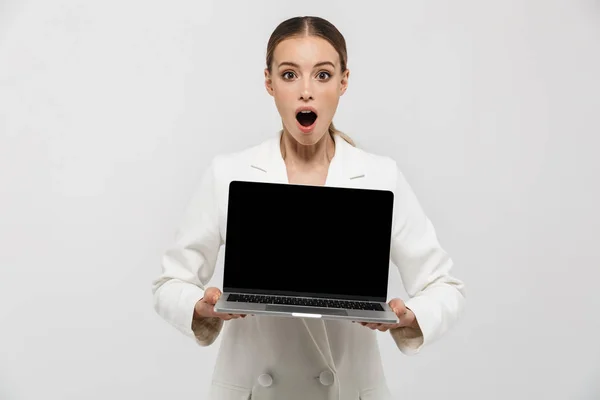 Photo of excited businesswoman 20s wearing elegant jacket holdin — Stock Photo, Image