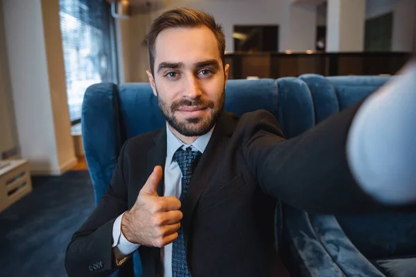 Handsome young excited businessman wearing suit — Stock Photo, Image