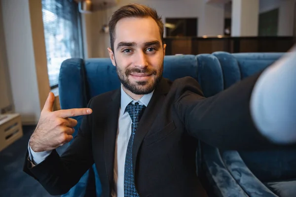 Handsome young excited businessman wearing suit — Stock Photo, Image