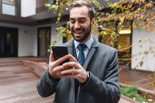 Attractive young businessman wearing suit walking — Stock Photo, Image