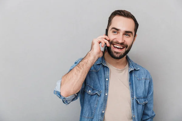 Excited cheerful man wearing shirt standing isolated — Stock Photo, Image