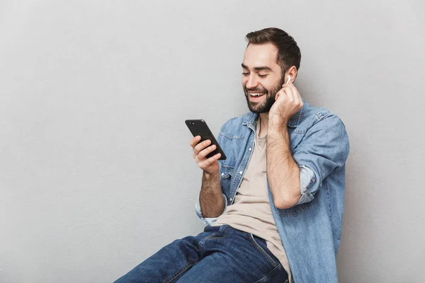 Excited cheerful man wearing shirt standing isolated — Stock Photo, Image