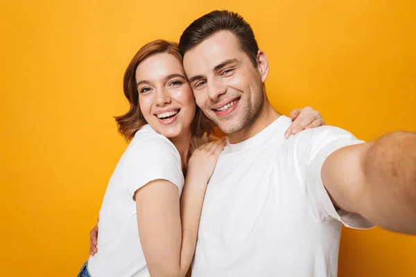 Portrait of a cheerful young couple standing — Stock Photo, Image