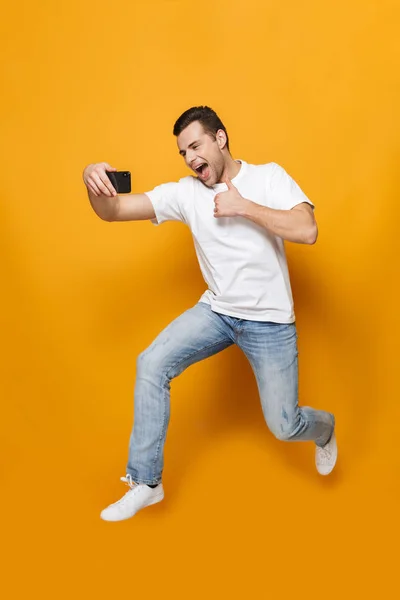 Full length portrait of a happy young man — Stock Photo, Image