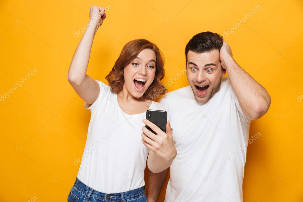 Portrait of a cheerful young couple standing