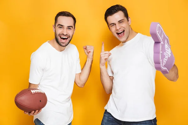 Two cheerful excited men friends wearing blank t-shirts — Stock Photo, Image