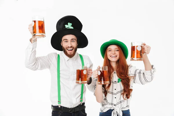 Happy young couple wearing costumes, celebrating — Stock Photo, Image