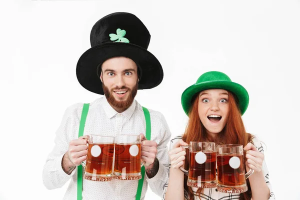 Happy young couple wearing costumes, celebrating — Stock Photo, Image