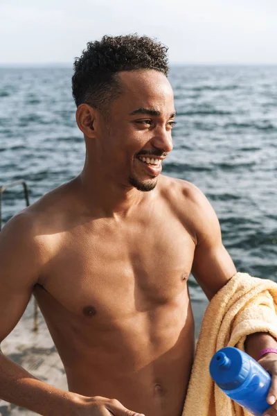 Young african sports man outdoors at the beach sea. — Stock Photo, Image