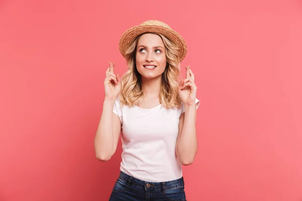 Portrait of elegant blond woman 20s wearing straw hat keeping fi — Stock Photo, Image