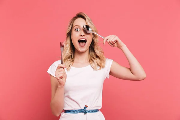 Portrait of excited blond woman 20s wearing body measuring tape — Stock Photo, Image