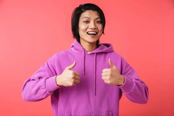 Foto de alegre asiático cara 20s vestindo camisola rejoicing e s — Fotografia de Stock