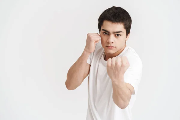 Confident young sportsman doing boxing exercises — Stock Photo, Image