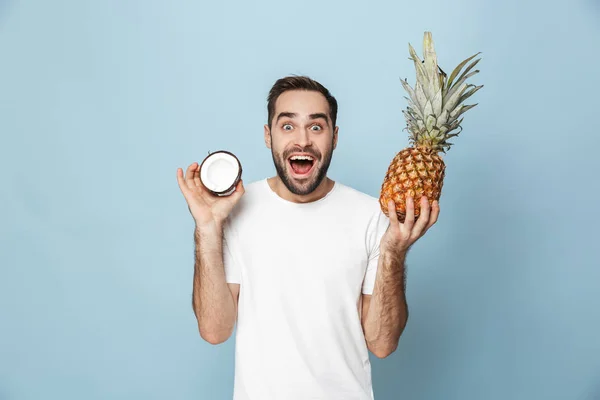 Cheerful excited man wearing blank t-shirt standing — Stock Photo, Image