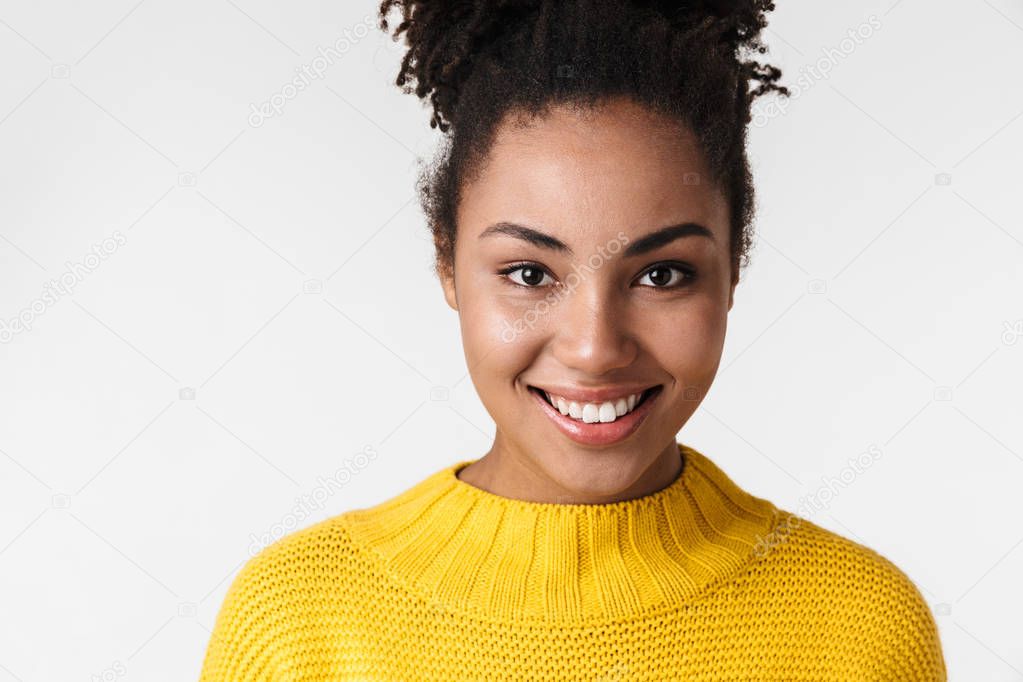 Beautiful young african happy excited emotional woman posing isolated over white wall background.