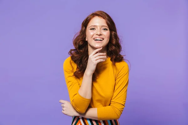 Portrait of a pretty young redheaded woman standing — Stock Photo, Image