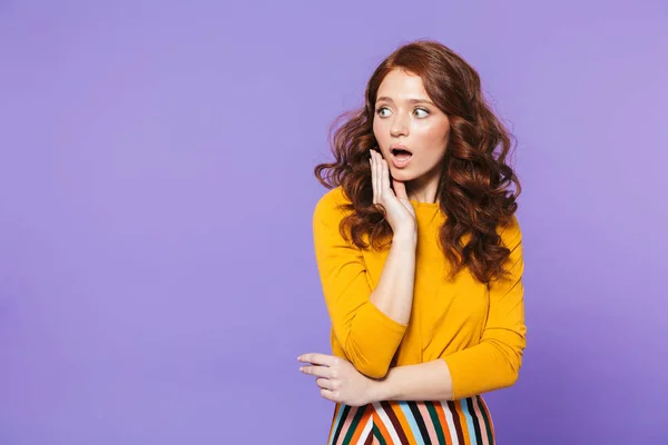 Portrait of a pretty young redheaded woman standing — Stock Photo, Image
