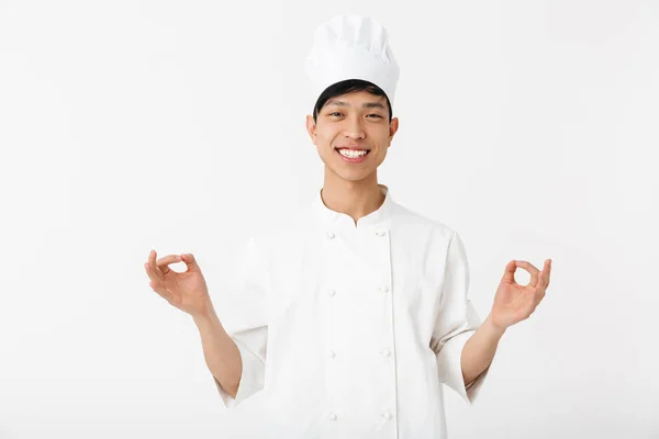 Excited asian chef wearing uniform standing — Stock Photo, Image
