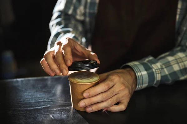 Cropped image of modern barista boy making coffee while working — Stock Photo, Image