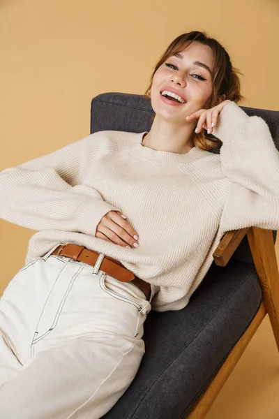 Beautiful young woman wearing sweater relaxing — Stock Photo, Image