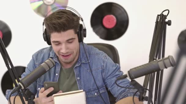 Happy Handsome Man Denim Jacket Using Smartphone Broadcast Radio — Stock Video