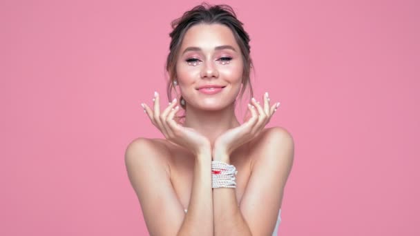 Beauty Pleased Brunette Woman Pearls Face Hands Posing Pink Background — Stock Video