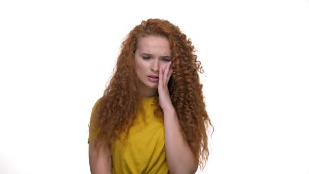 Upset Young Redhead Curly Lady Shaking Head Touching Her Face — Stock Video