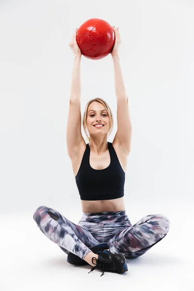 Immagine di una donna bionda sana, sulla ventina, vestita di abbigliamento sportivo — Foto Stock