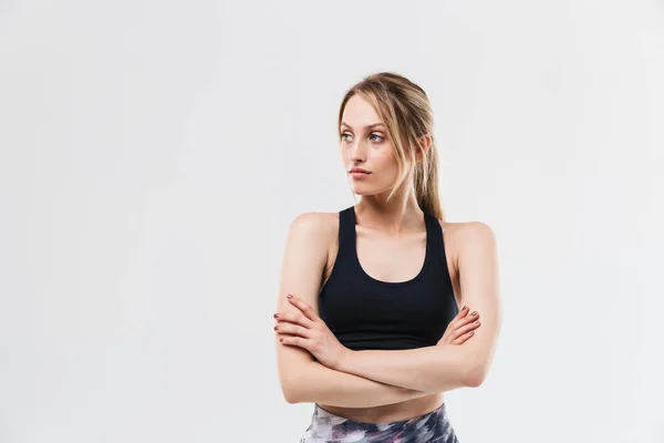 Imagen de mujer rubia atlética de 20 años vestida con ropa deportiva trabajando —  Fotos de Stock