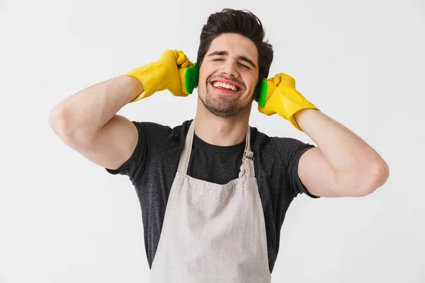 Handsome brunette houseman wearing apron — Stock Photo, Image